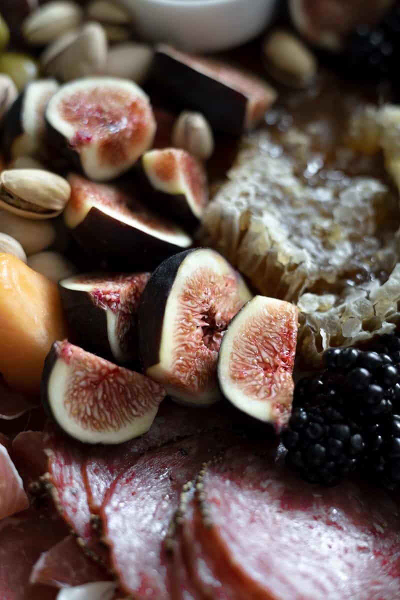 Detail shot of the fresh figs on a charcuterie board. 