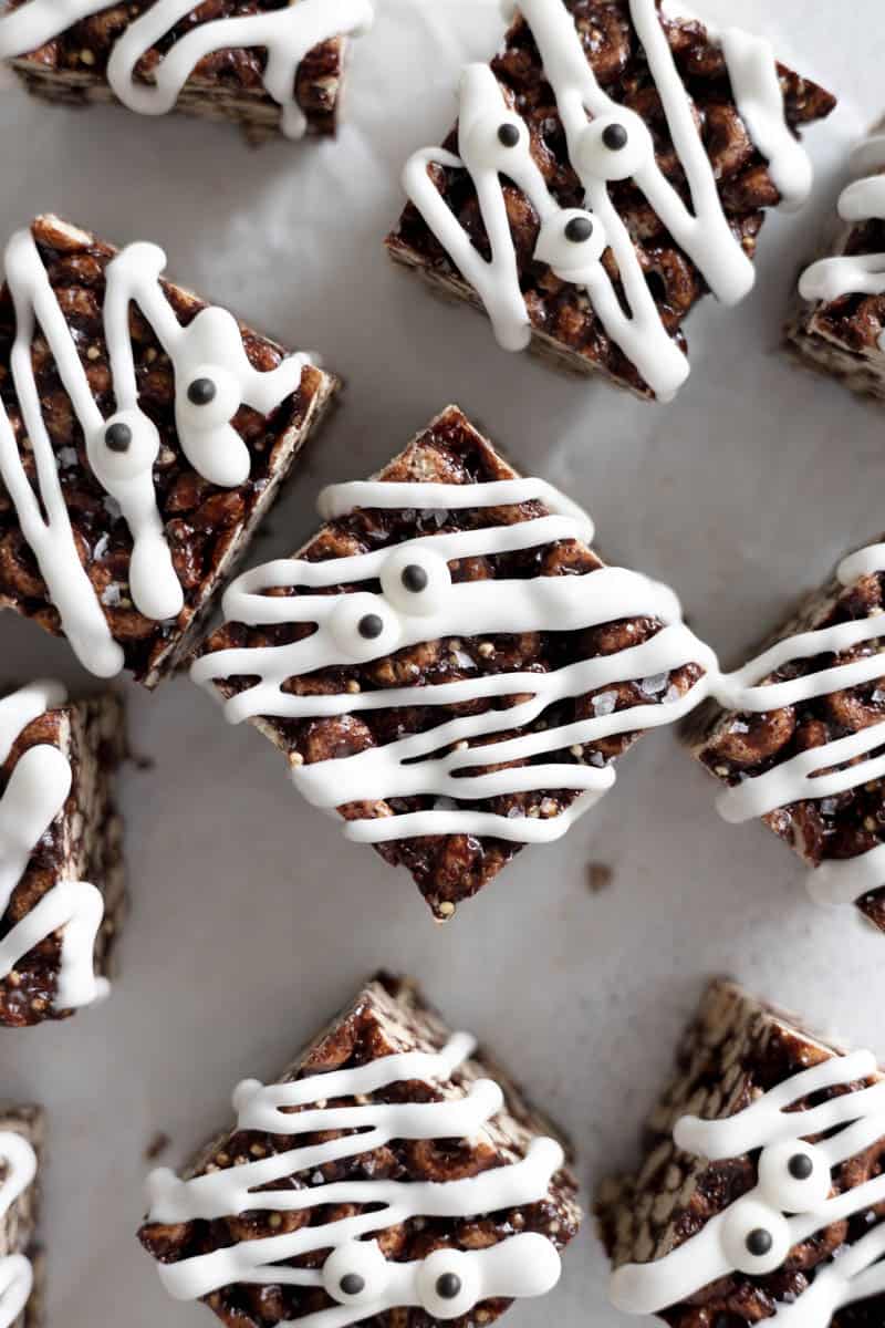 Chocolate rice krispies with white icing and edible candy eyeballs.