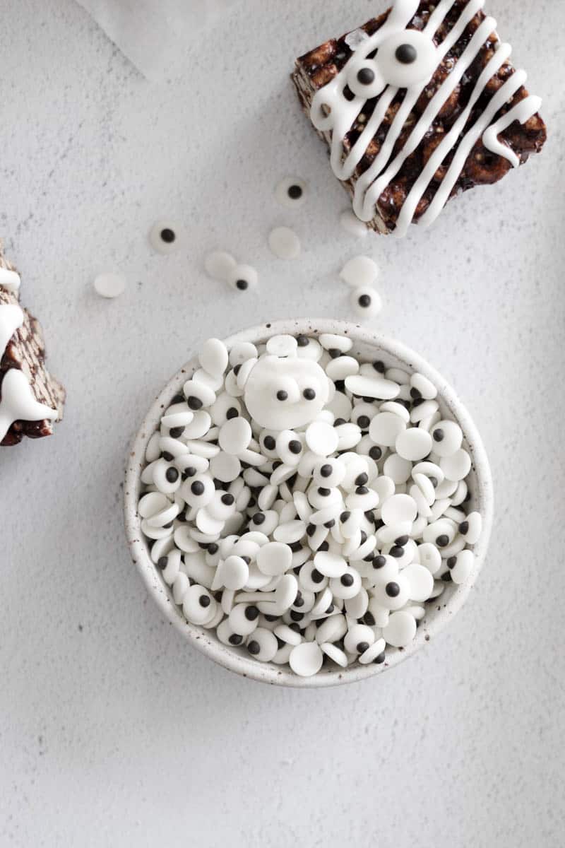 Edible candy eyeballs in a white bowl. 