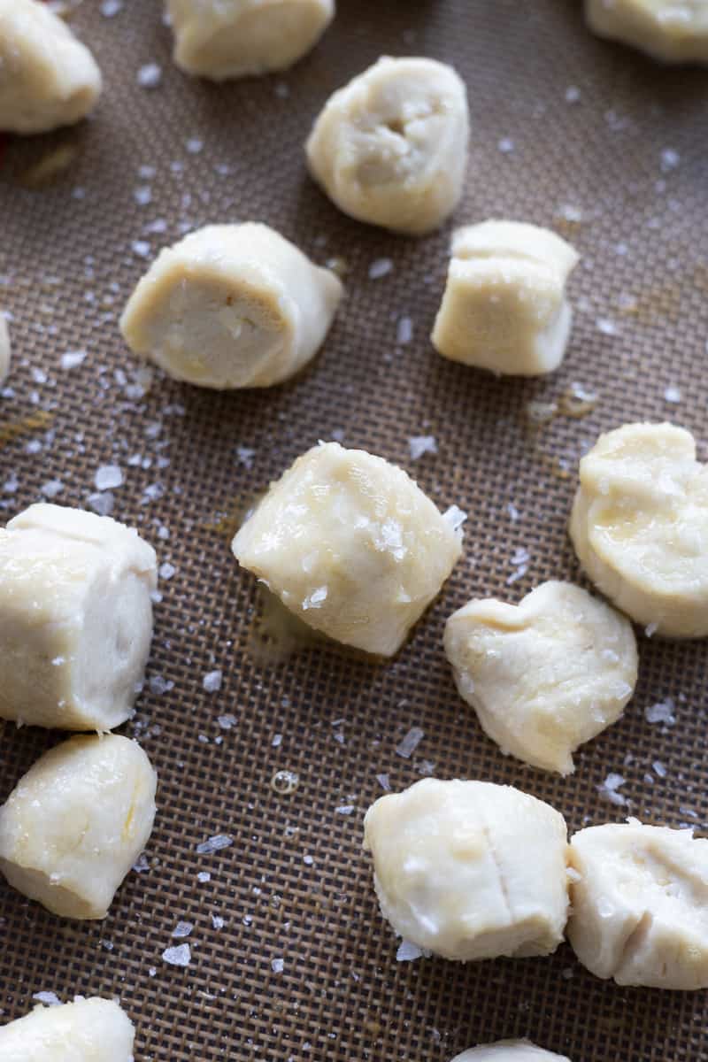 Sourdough pretzel bites brushed with egg wash and flaky sea salt.