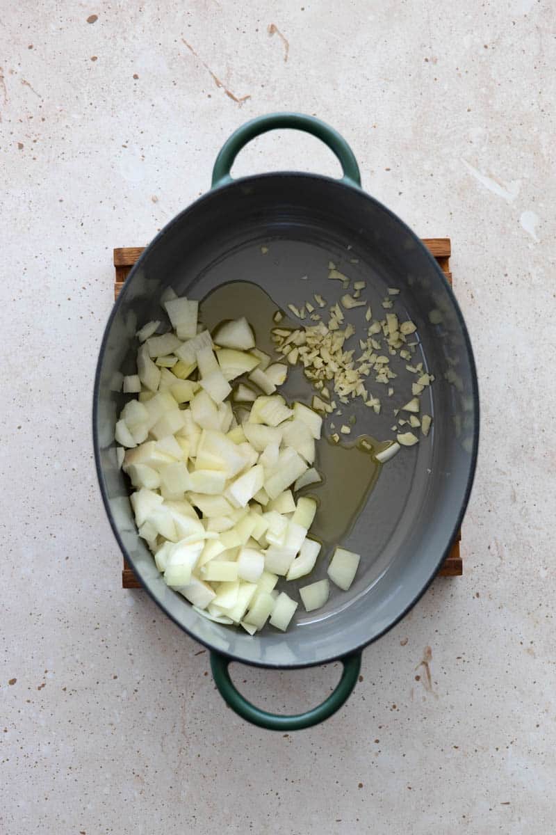 Onions, garlic and olive oil in a Dutch Oven.