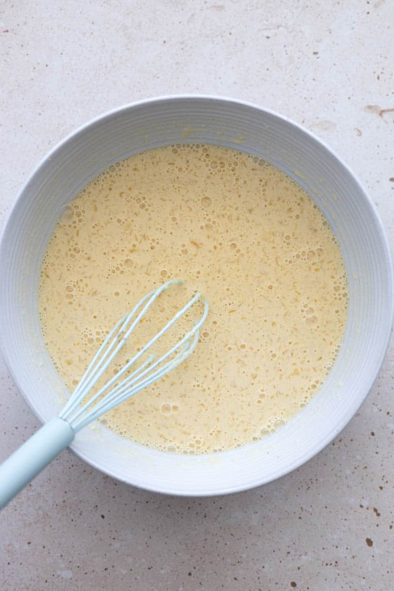 Wet ingredients whisked together in a large bowl.