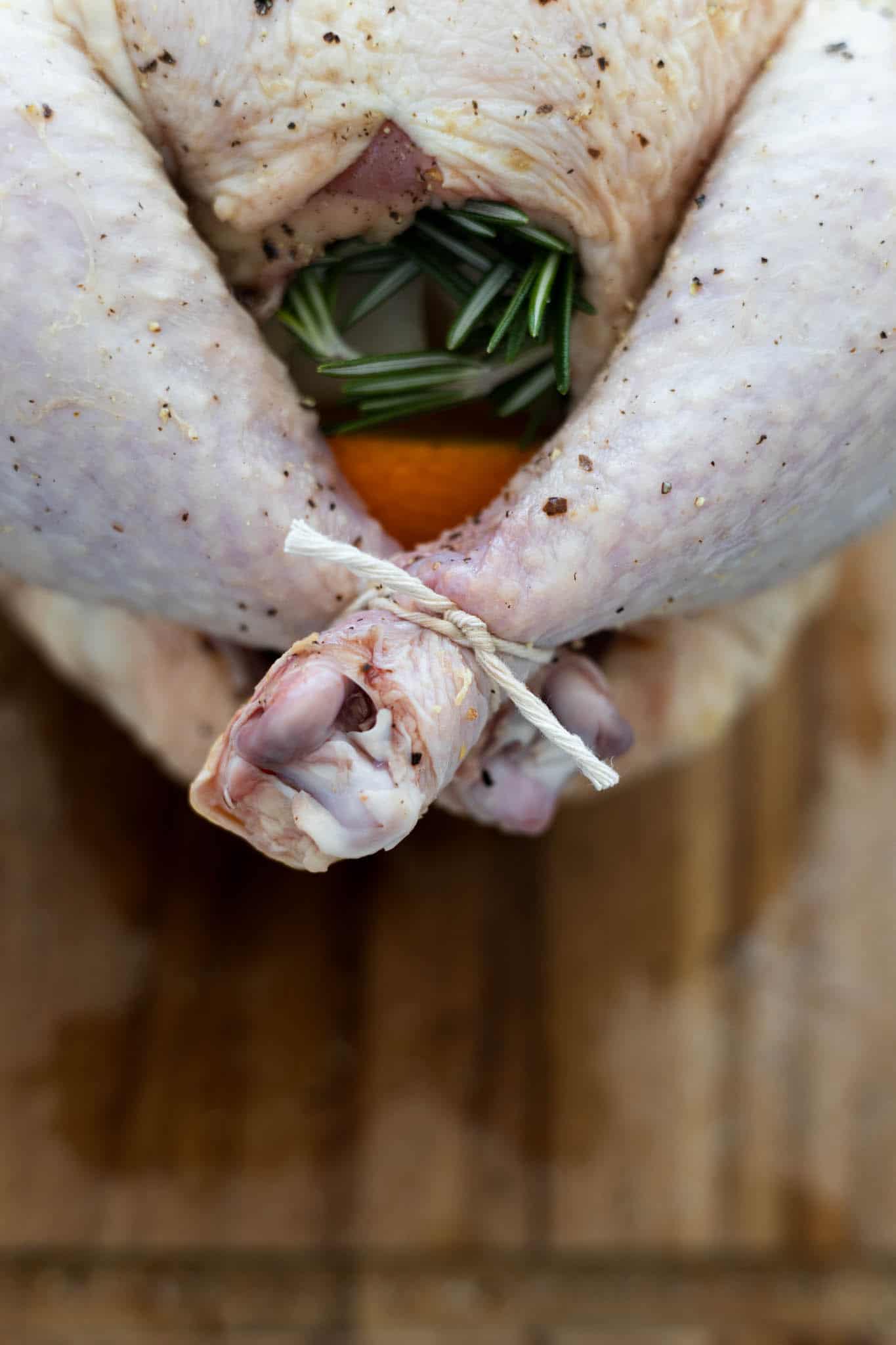 The tied legs of the stuffed chicken.