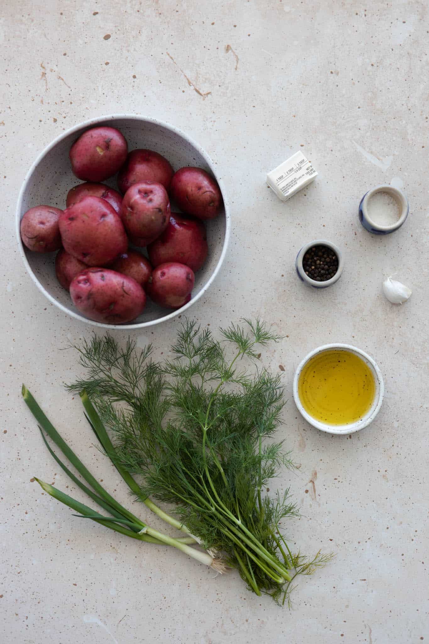 Ingredients for Smashed Potatoes with Green Onions & Dill on a table.