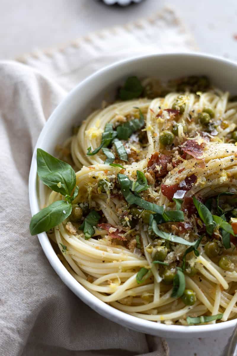 A closeup of the pasta dish in a white bowl. 