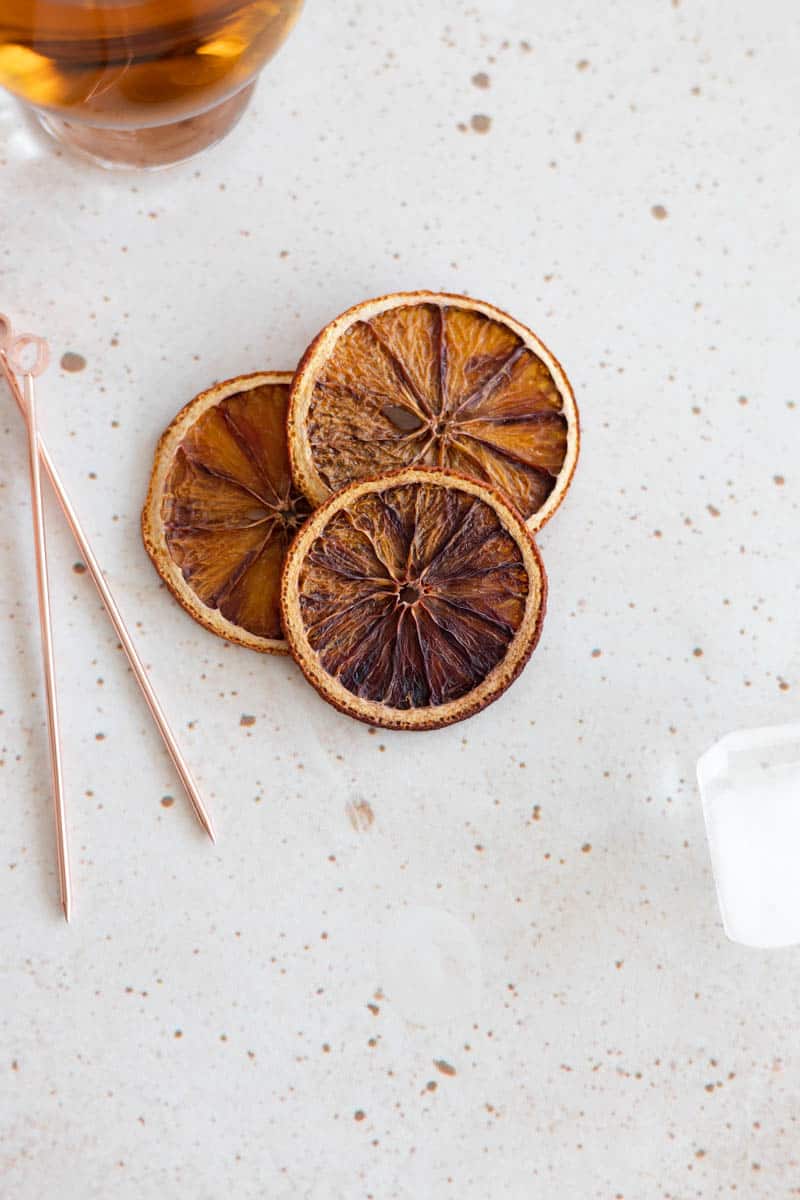 3 dried blood oranges with a cocktail pick.