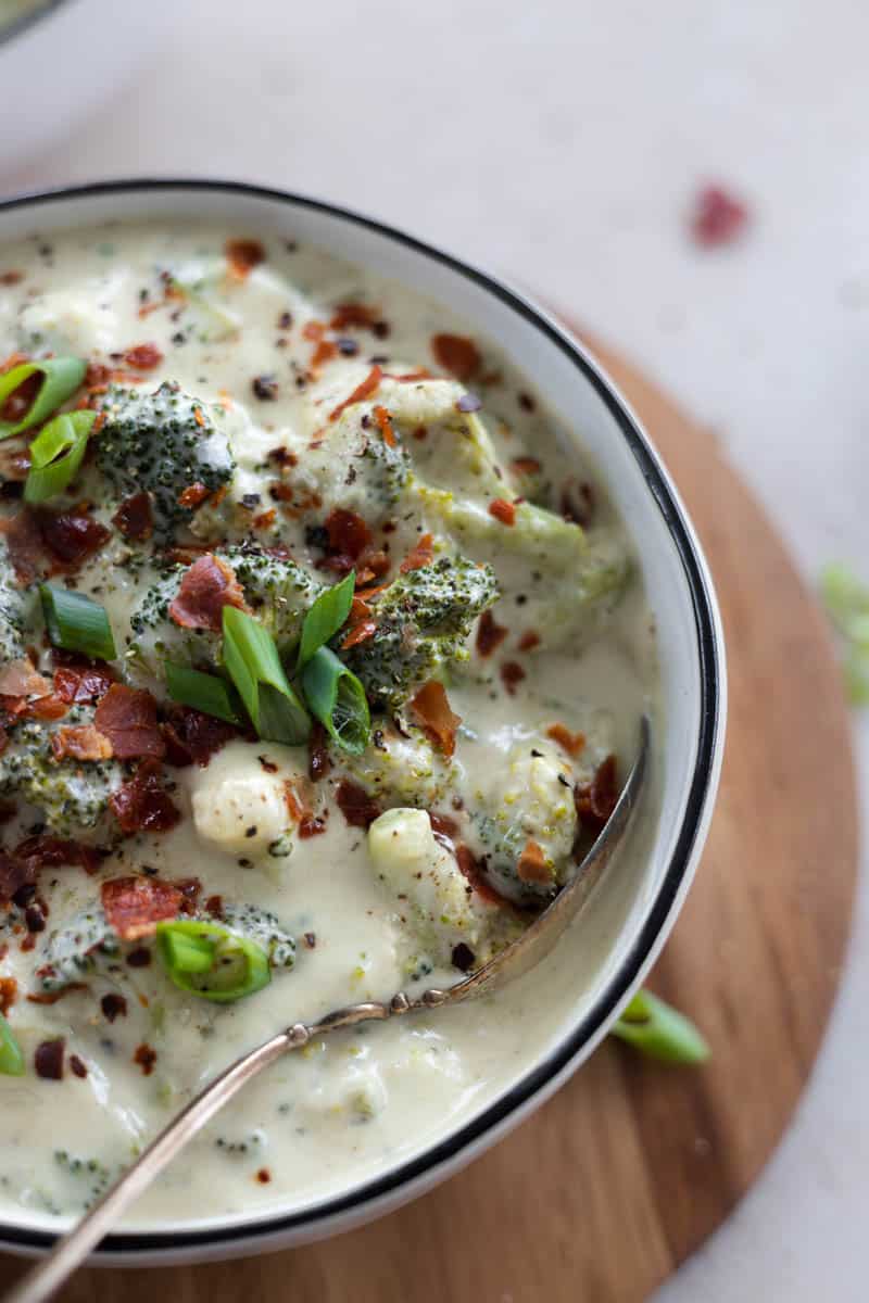 A closeup of Dairy-Free Broccoli Soup in a white bowl.