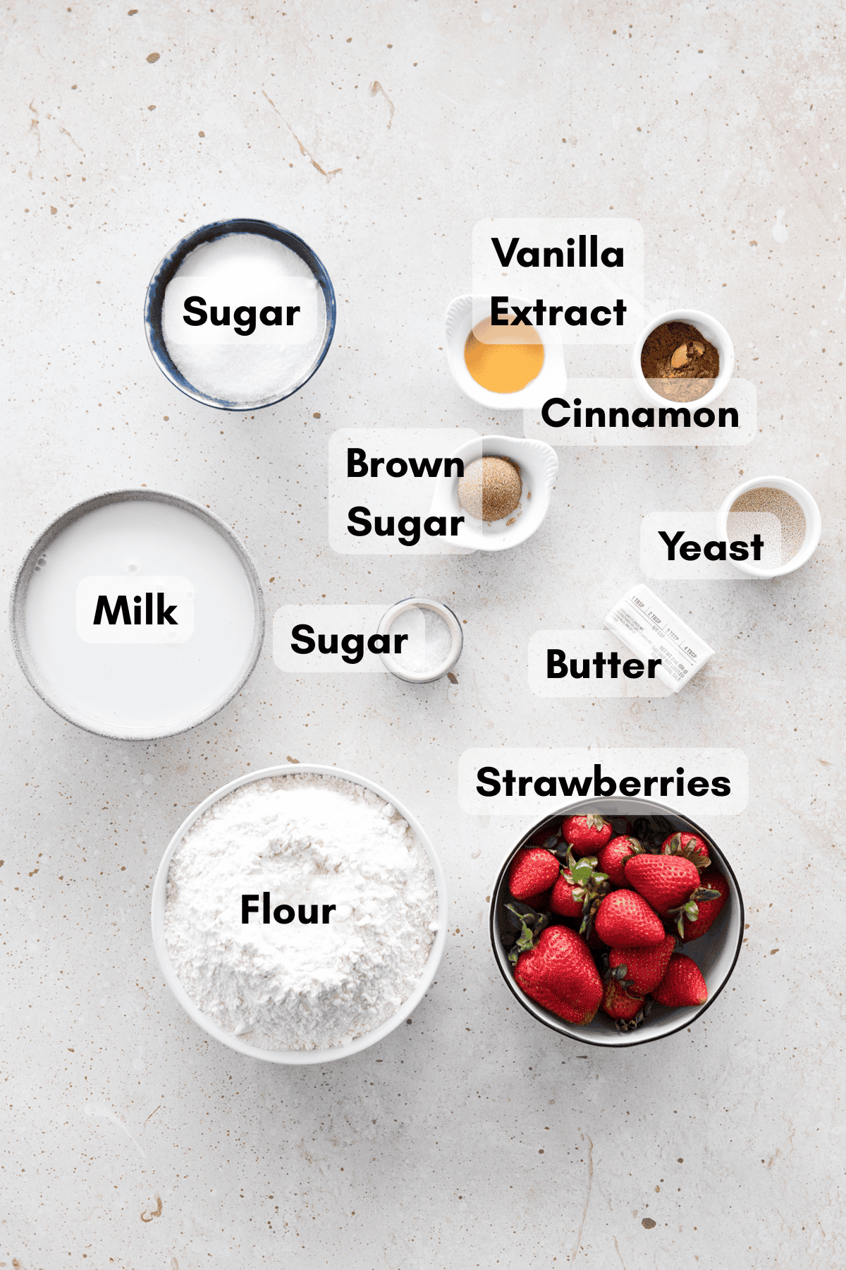 Ingredients for cinnamon sugar pretzels in small bowls.