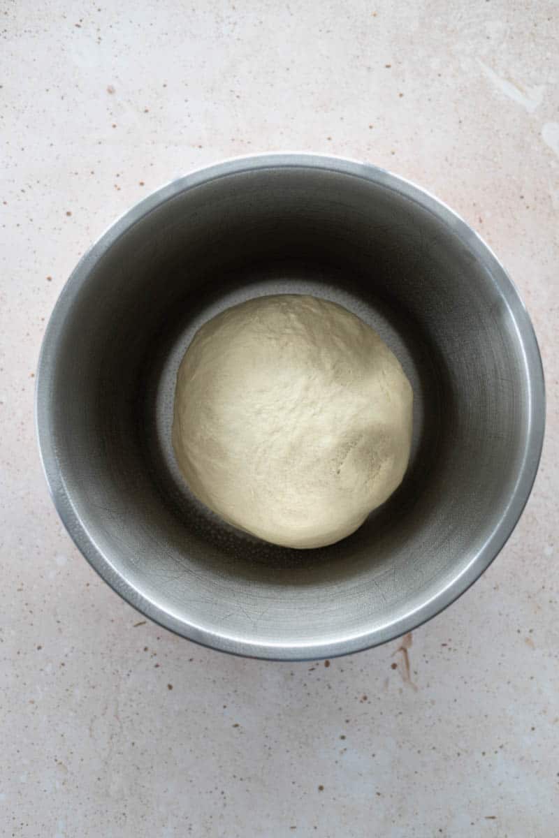 The dough ball in a bowl to rise.