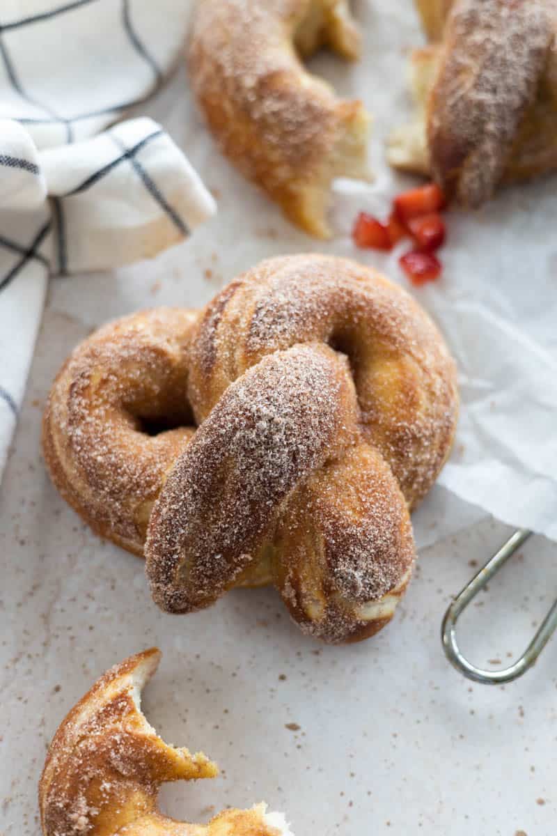 Cinnamon Sugar Pretzels on a sheet of parchment paper.