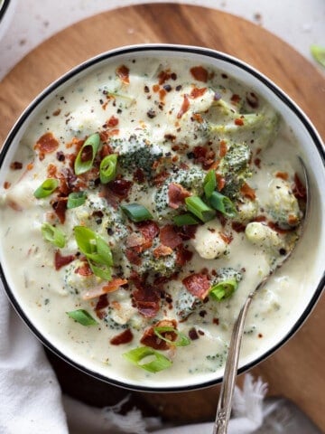 An overhead shot of Dairy-Free Broccoli Soup in a white bowl.