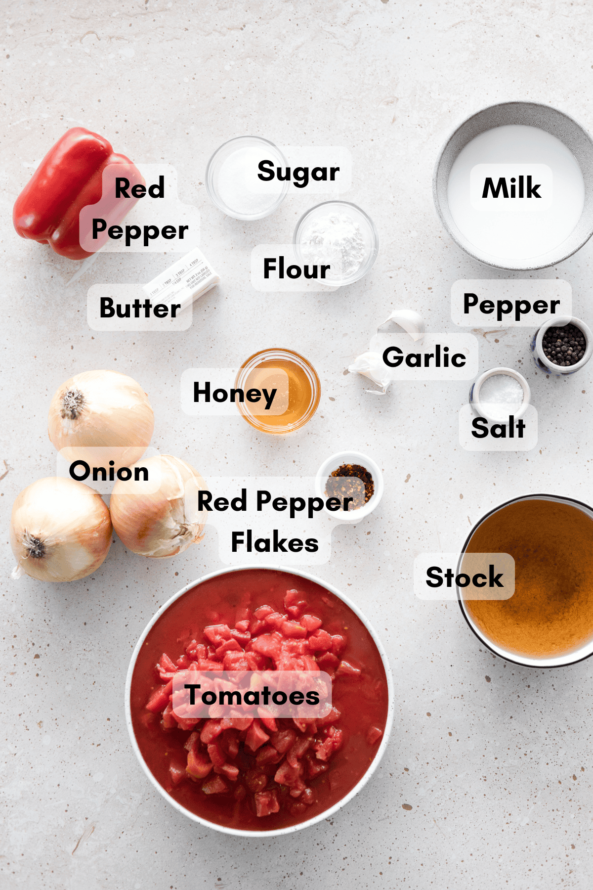 Ingredients for Roasted Red Pepper and Tomato Soup in small bowls.