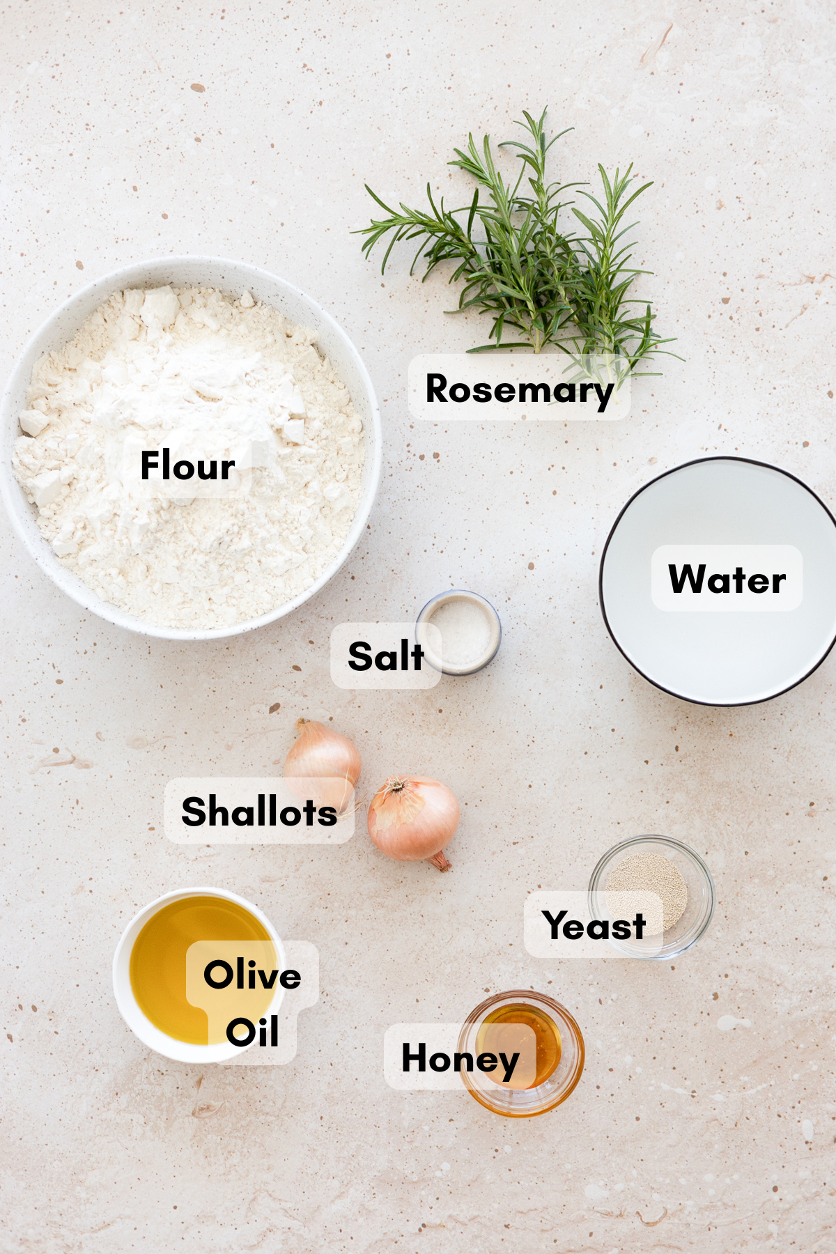 Ingredients for Focaccia with Rosemary and Shallots in small bowls. 