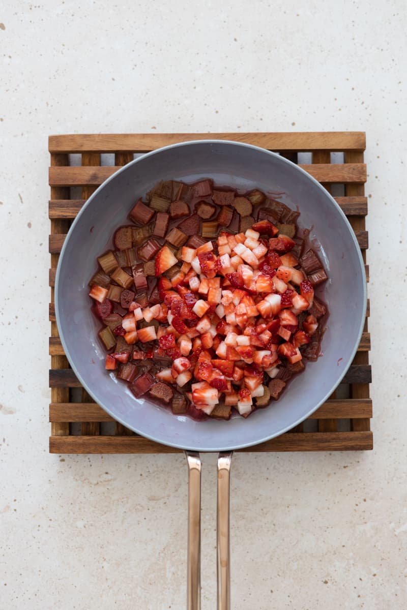 Rhubarb and strawberries in a small skillet. 