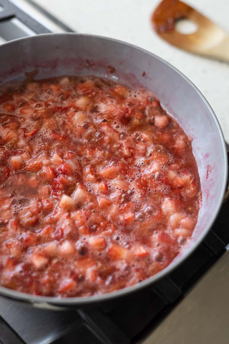 Berry mixture simmering on the stovetop. 