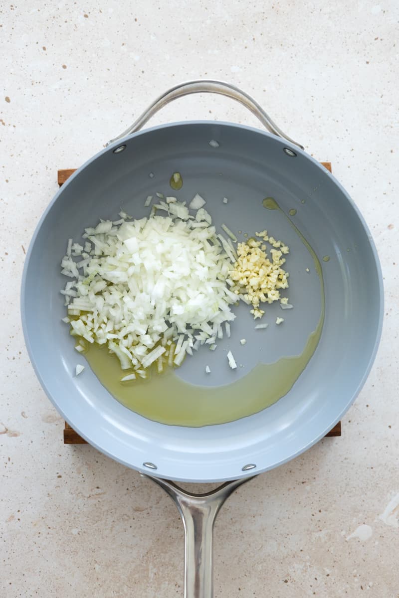 Onions and garlic in a sautée pan with olive oil. 