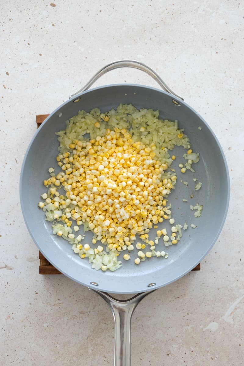 Corn added to the sautée pan with the onions and garlic. 