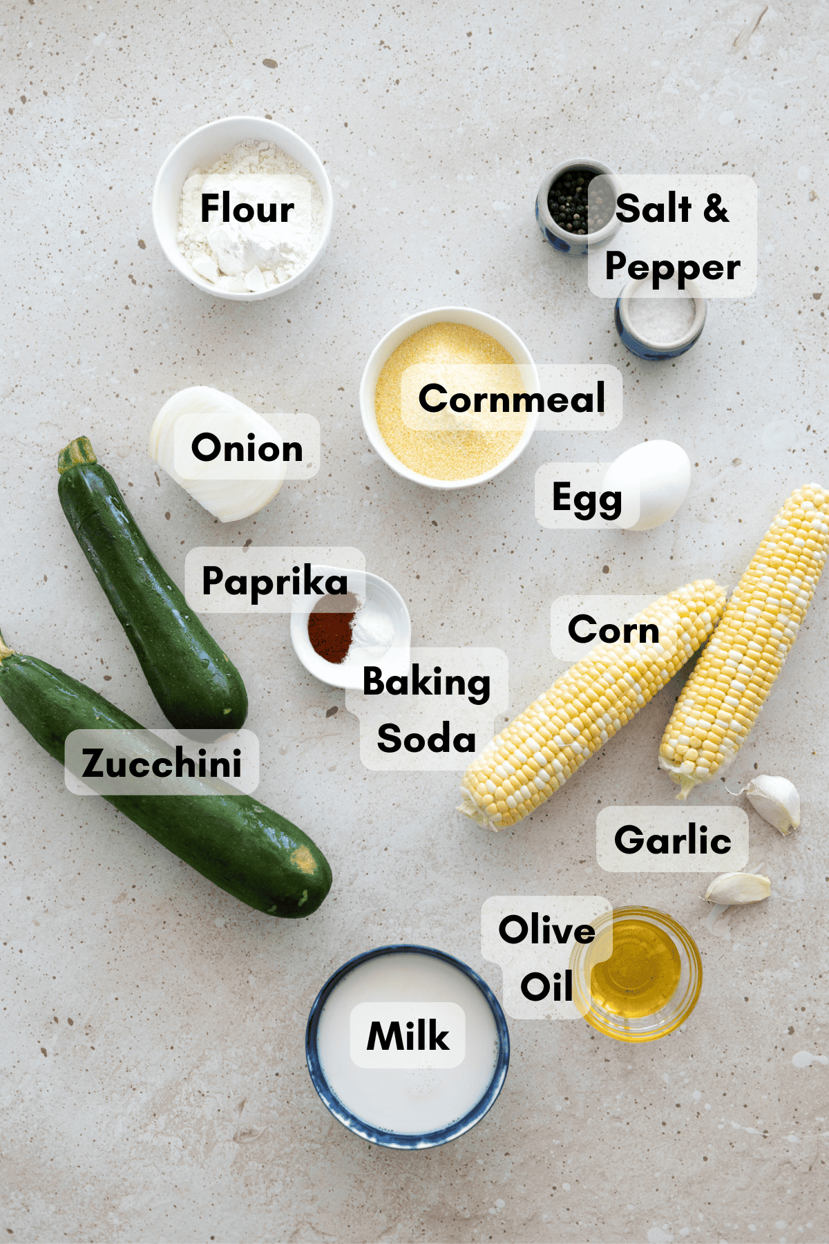Ingredients for Zucchini and Sweetcorn Fritters in small bowls. 
