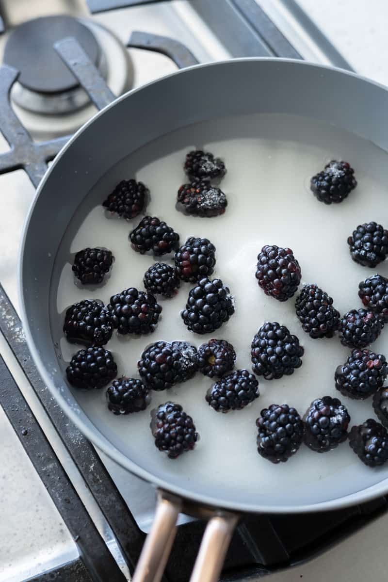 Blackberries added to the mixture in the skillet. 