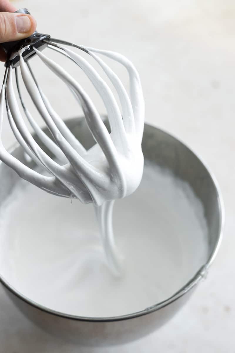 The whipped, white marshmallow mixture on the whisk attachment from the stand mixer. 