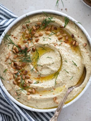 Lemon Dill Hummus in a white bowl.