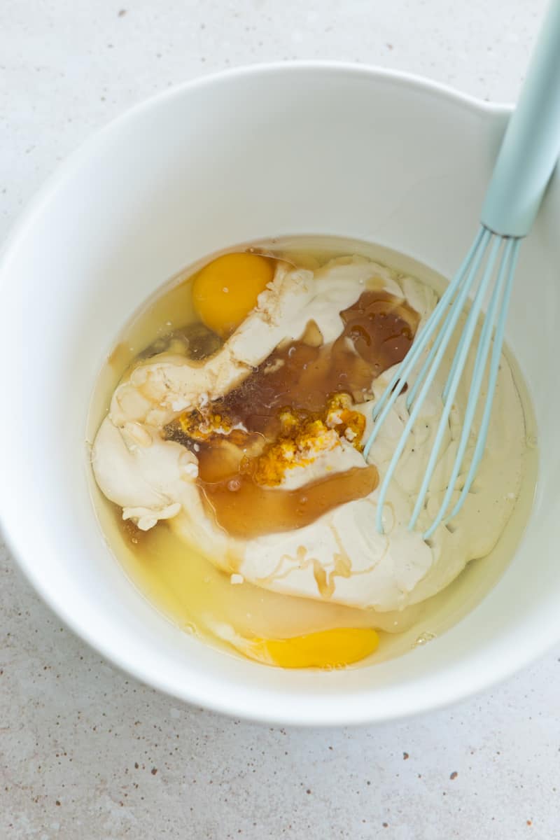 We ingredents in a bowl with a whisk, ready to mix.