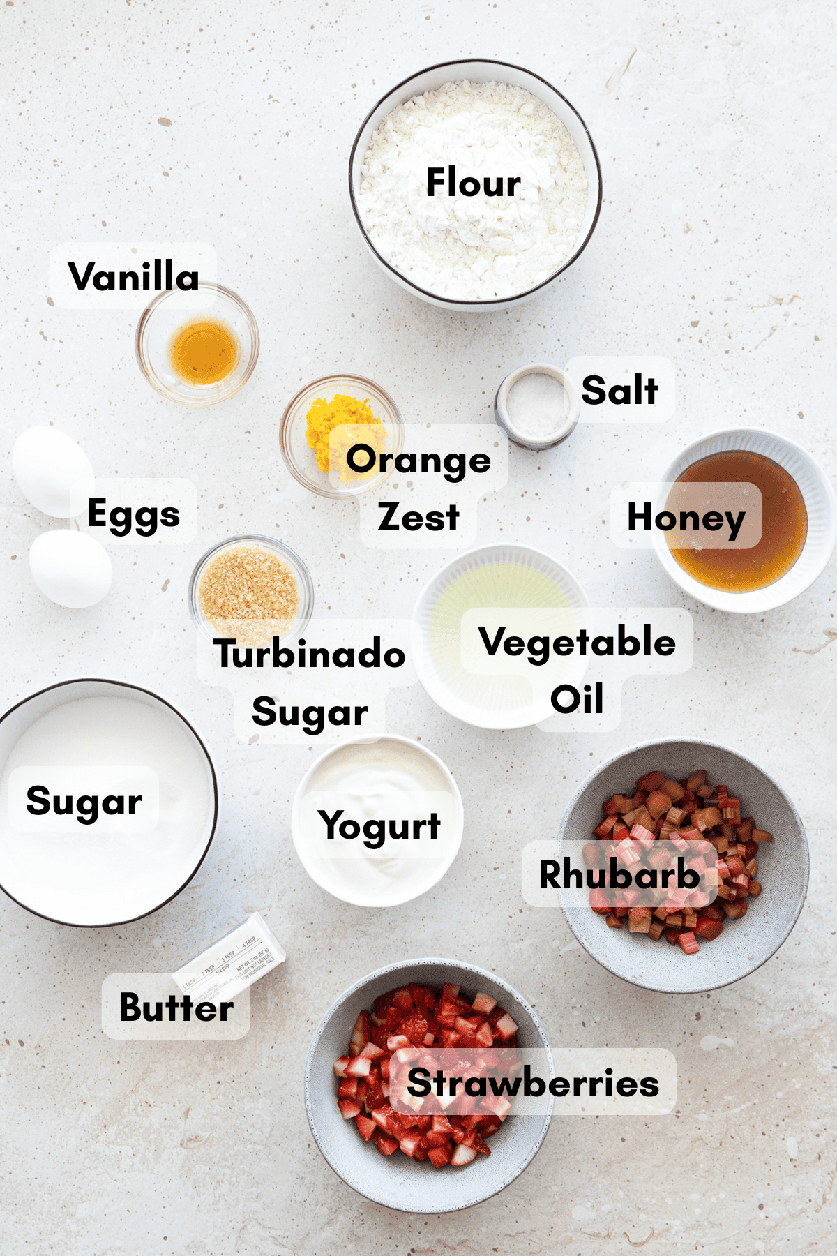 Ingredients for Strawberry Rhubarb Muffins in small bowls.
