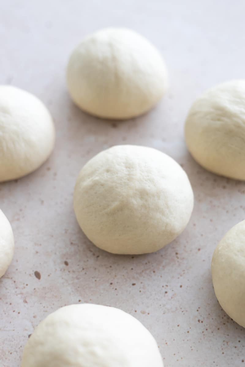 Each dough piece rolled into a smooth ball. 