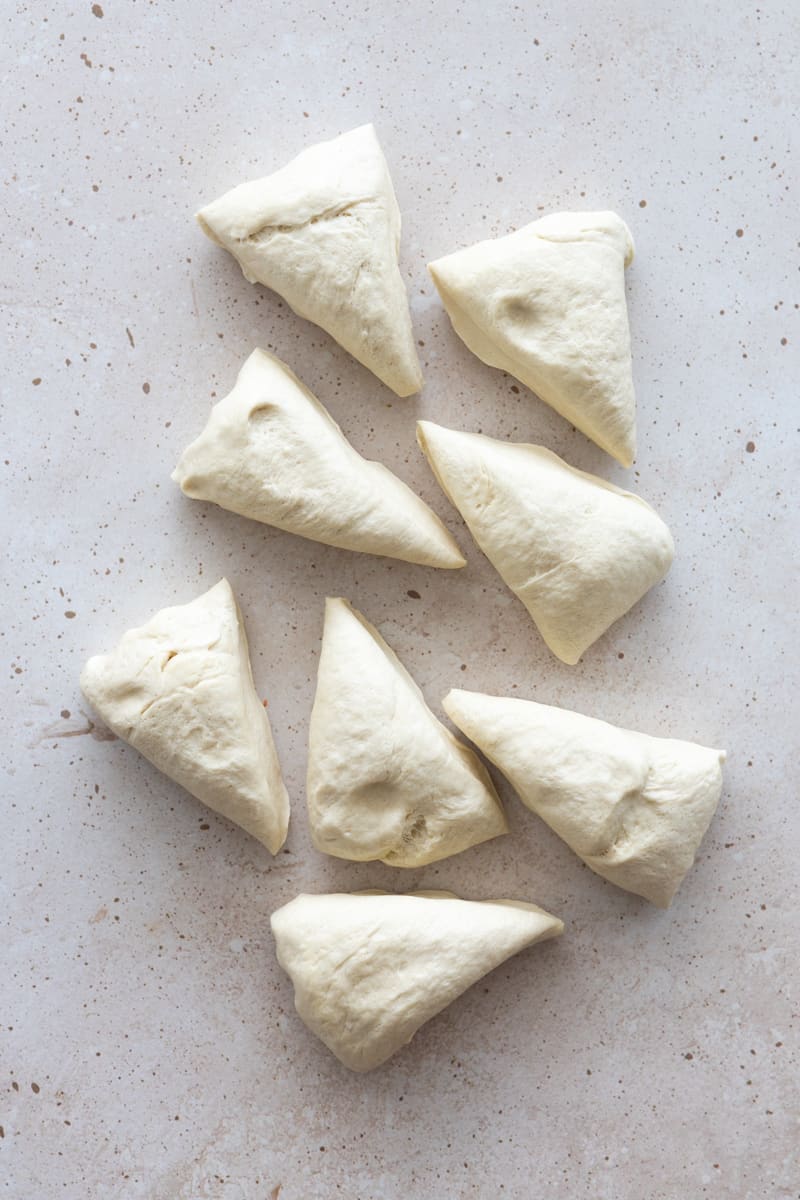 Dough divided into 8 equal triangular pieces. 