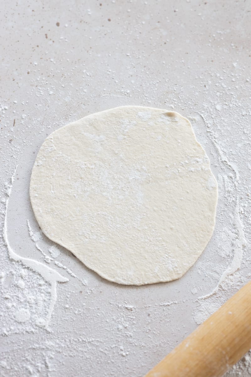 Dough rolled into a circle. 