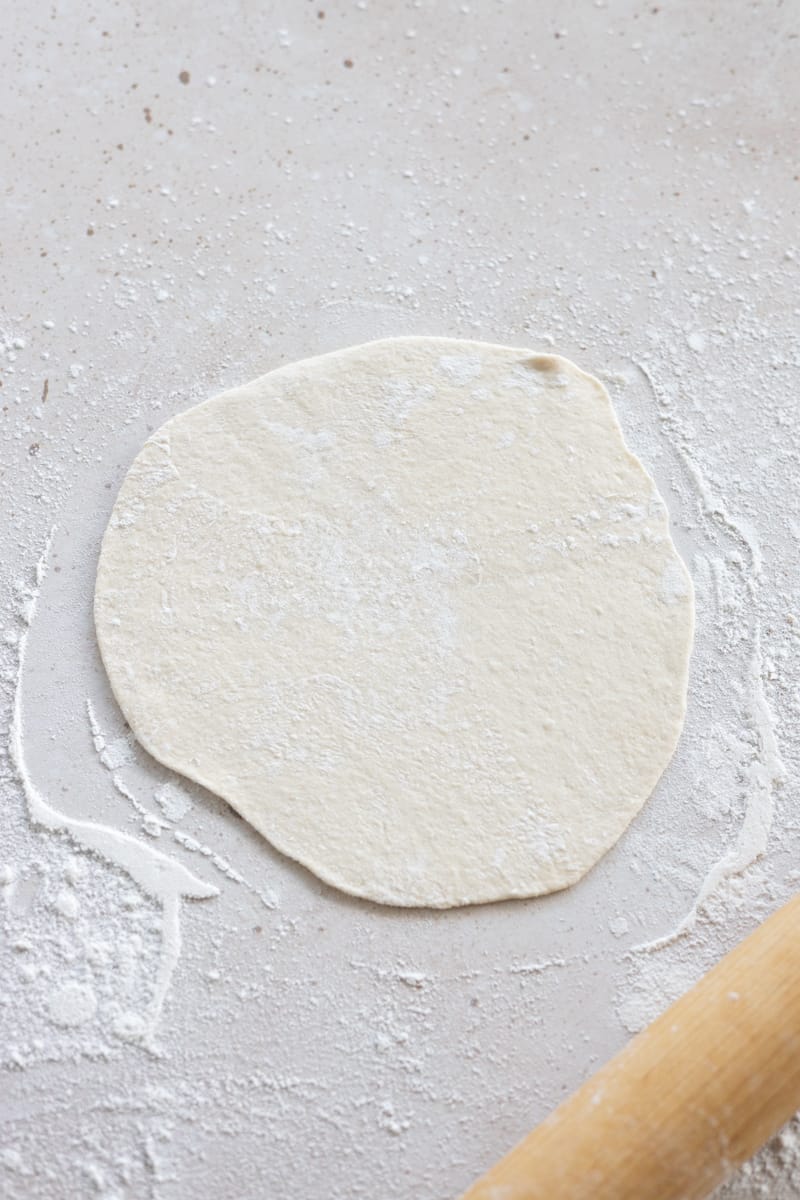 Dough rolled into a circle.