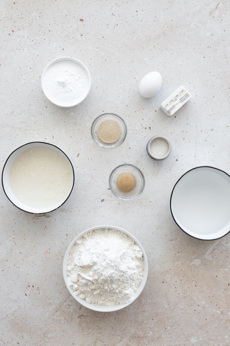 Ingredients for Sourdough Discard Pretzel Buns in small bowls. 