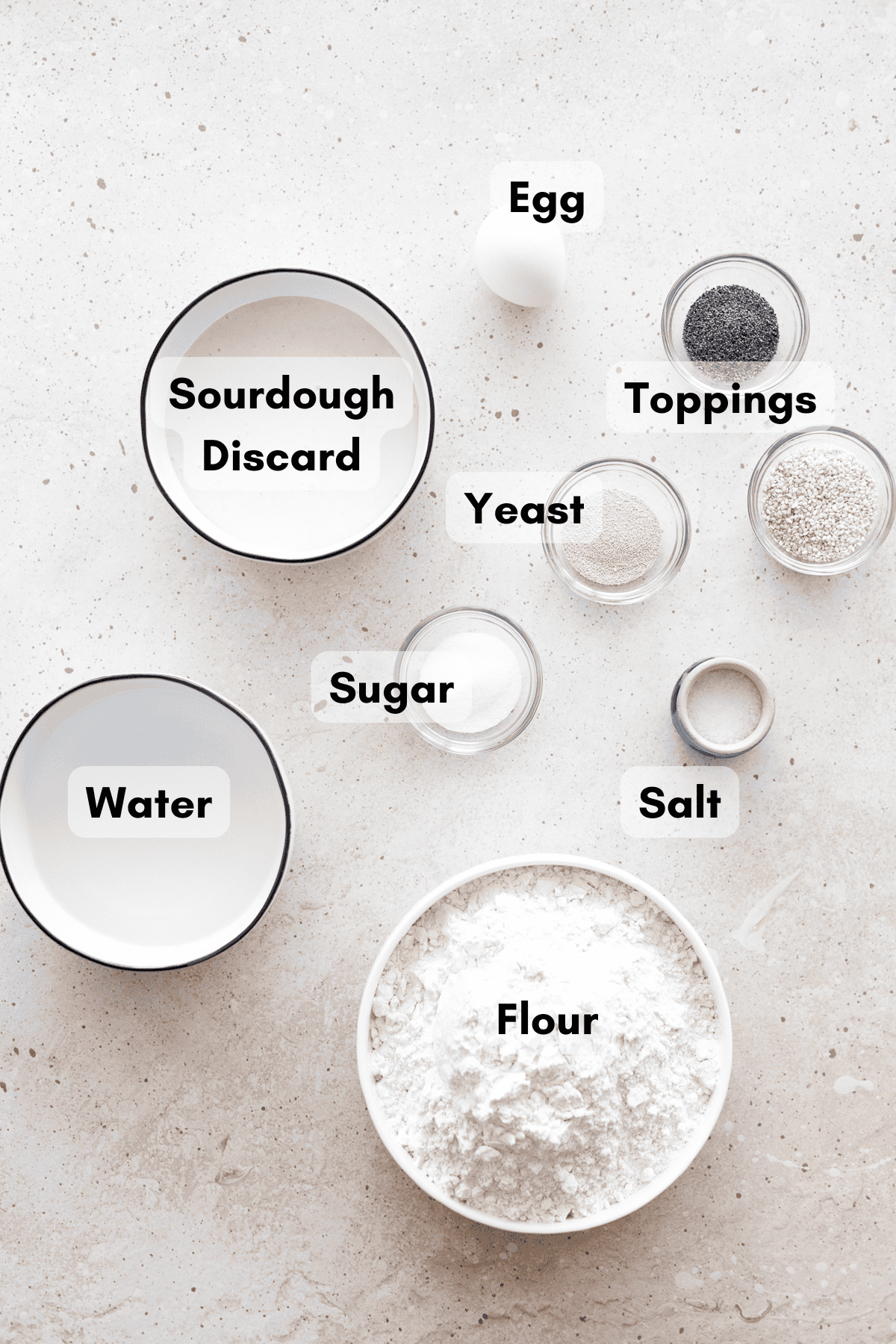 Ingredients for Sourdough Discard Bagels in small bowls. 