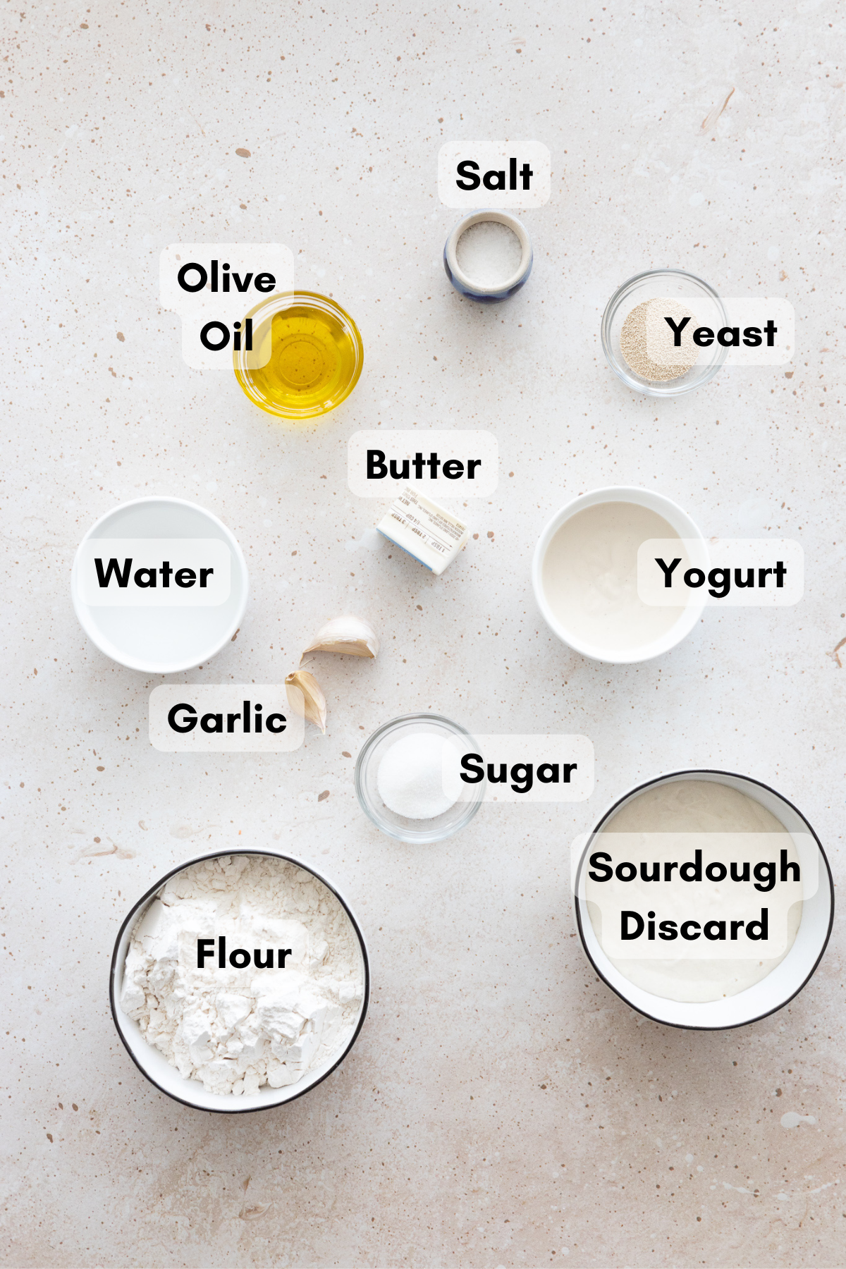 Ingredients for Sourdough Discard Naan in small bowls. 