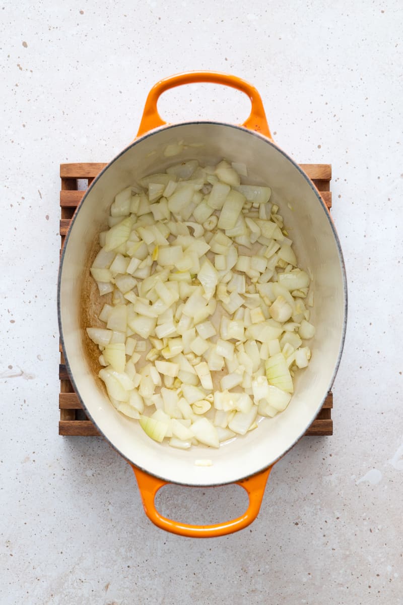 Onions and garlic in a large Dutch oven.