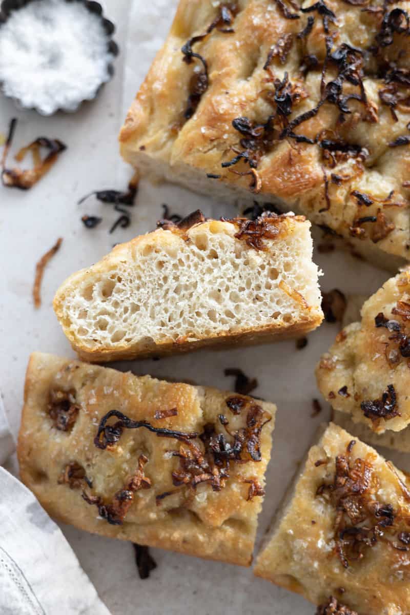 A side view of sliced Caramelized Shallot Focaccia. 