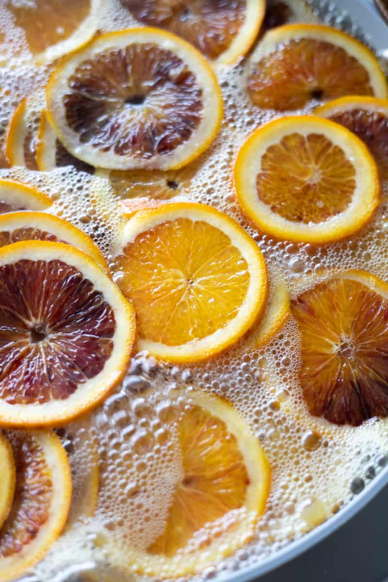 Oranges simmering in sugar water. 