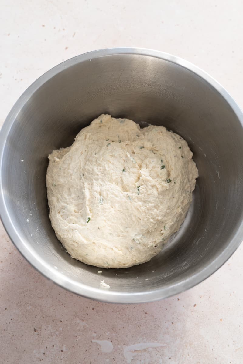 Shaggy dough in a large metal bowl. 