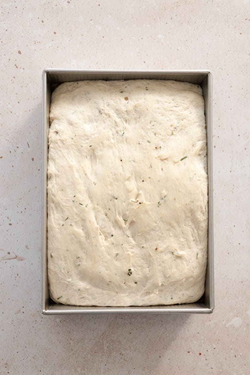 Dough after second rise filling the baking pan. 