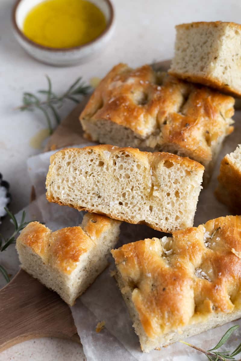 Closeup side view of a sliced piece of Rosemary Sourdough Focaccia. 