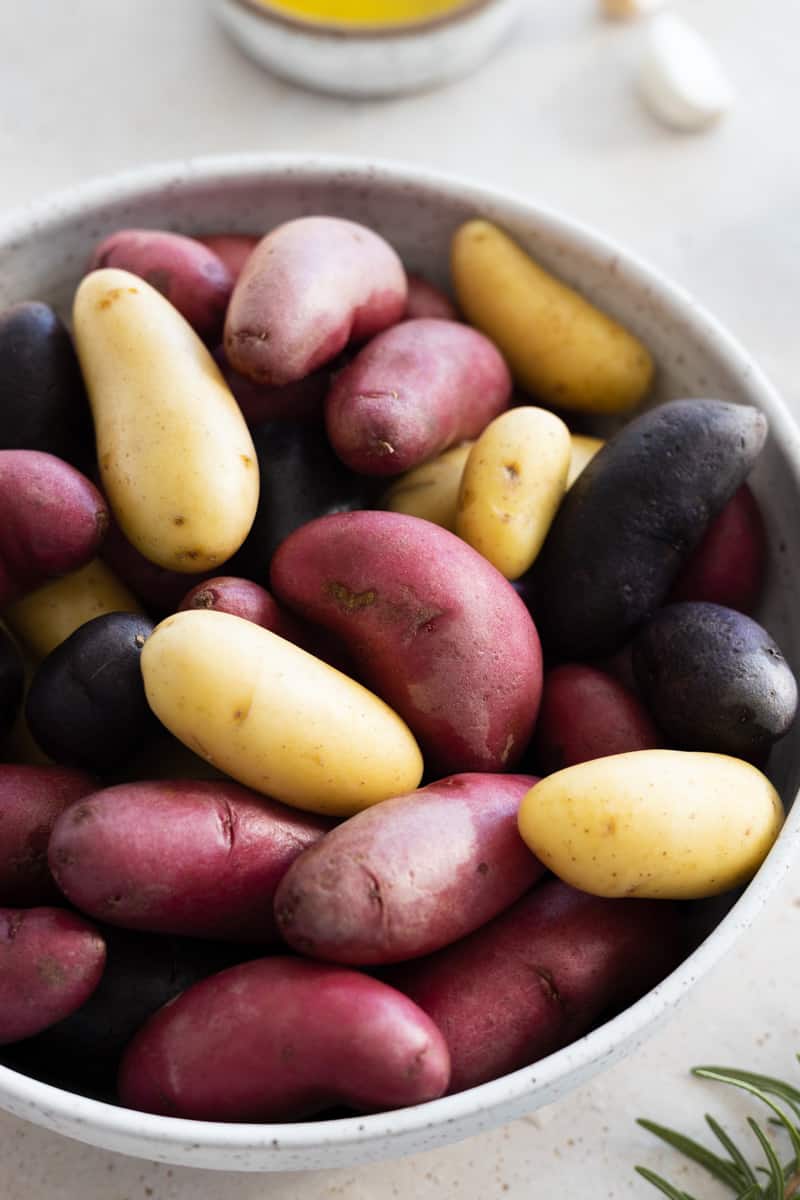Fingerling potatoes in a white bowl. 