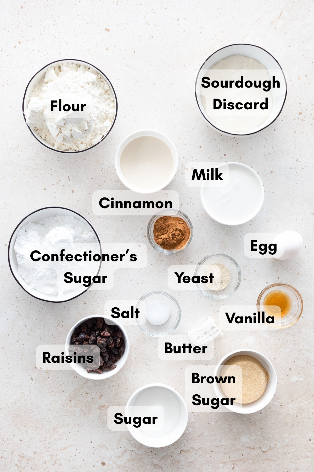 Ingredients for Sourdough Discard Cinnamon Rolls in small bowls.