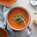 Tomato and Roasted Red Pepper Soup garnished with fresh basil.