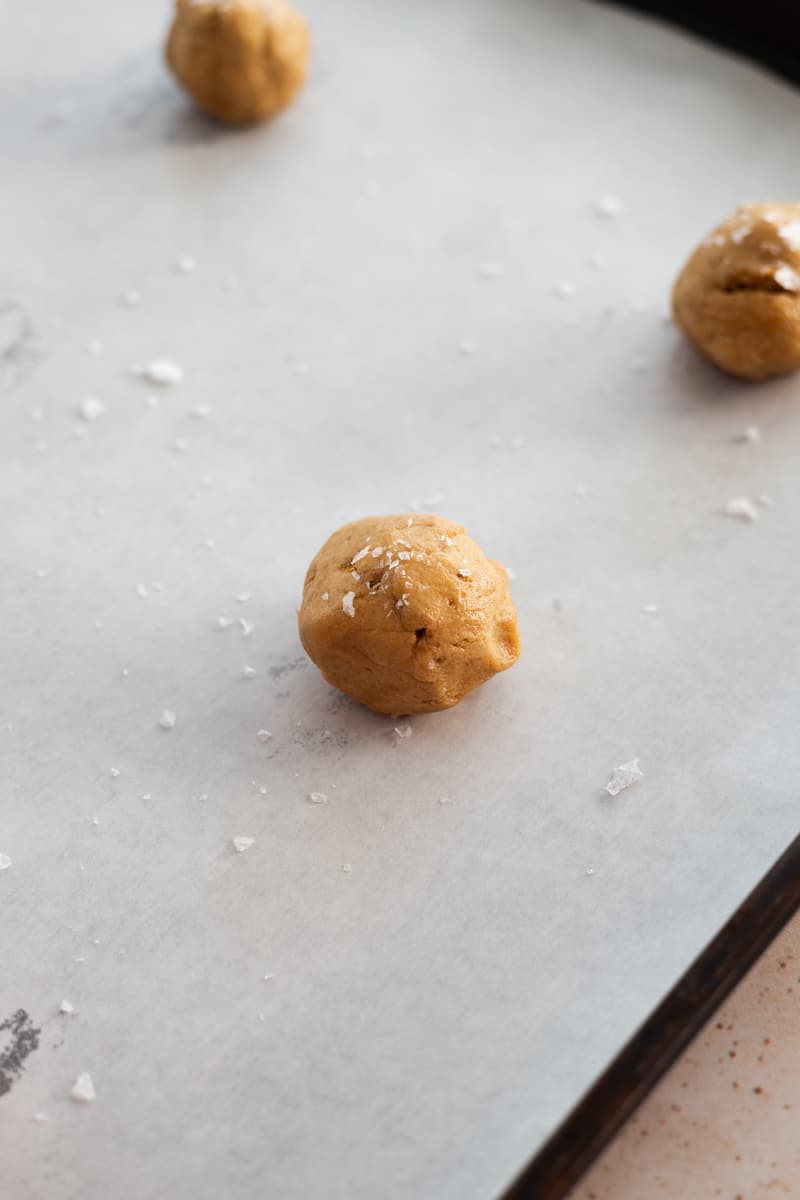 Cooke dough rolled into smooth balls with a sprinkle of sea salt. 