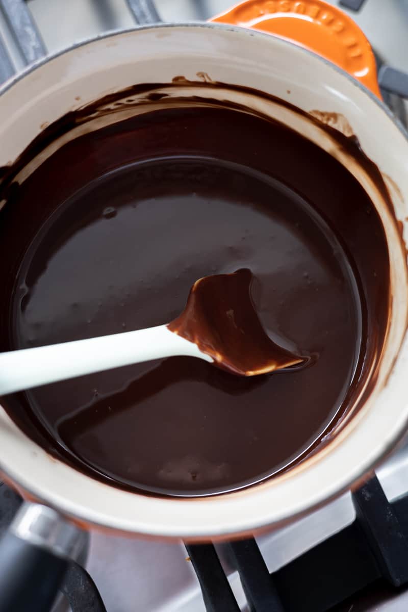 Melted chocolate in a small pot. 