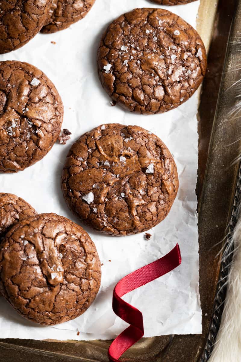 Final cookies on a platter with a red ribbon. 