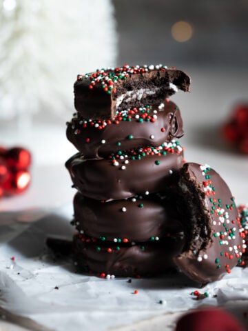 Stack of chocolate covered oreos.