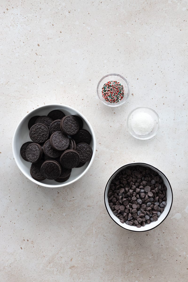 Ingredients for chocolate covered OREOs in small bowls. 