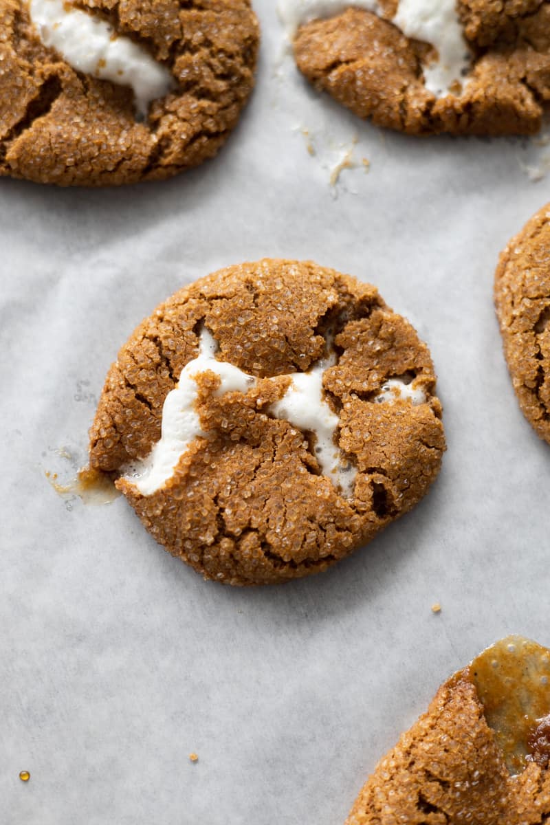 Baked cookie with marshmallow oozing from the cracks. 