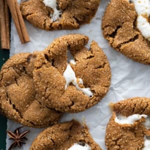 Molasses marshmallow stuffed cookies in a pile on a tray.